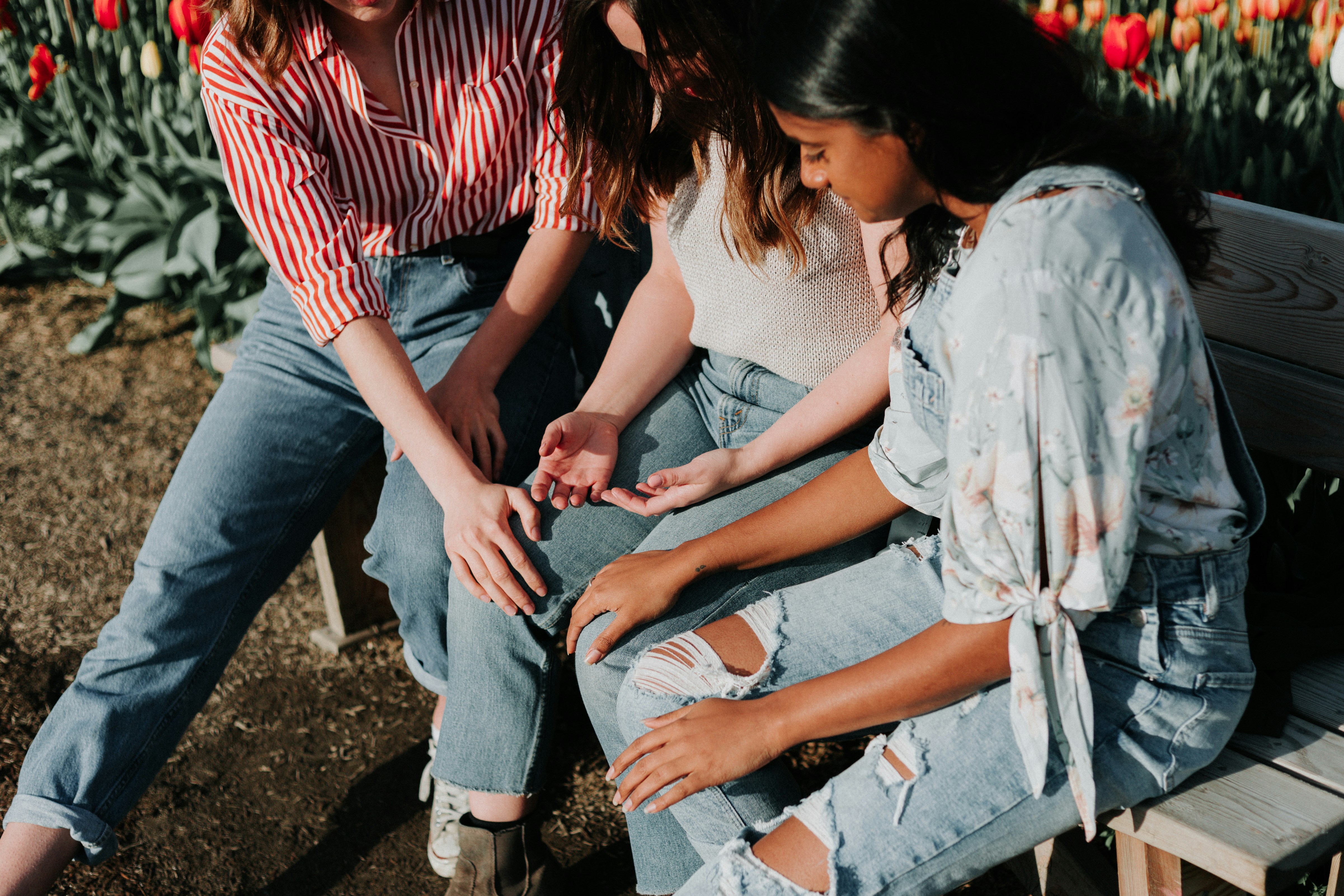 three woman praying together