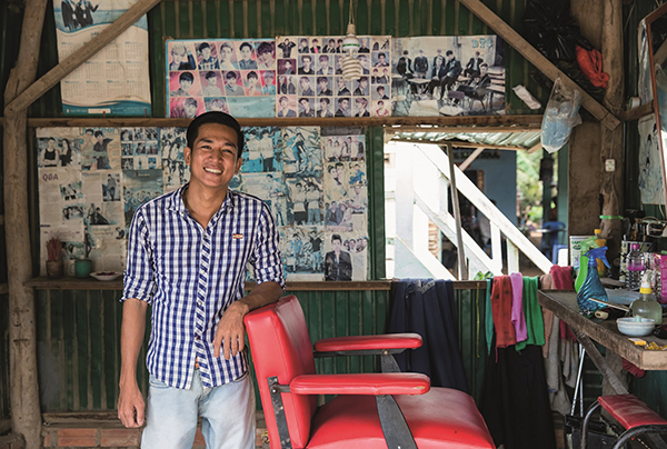 During Project Compassion 2018, Rattanak's story was shared. He stands in his barber shop after receiving support from the Caritas Deaf Development Program. Photo by Richard Wainwright caritas 600